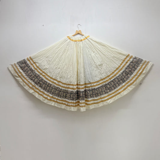 Elegant White Ghaghra with Golden Stripes and Black Floral Border